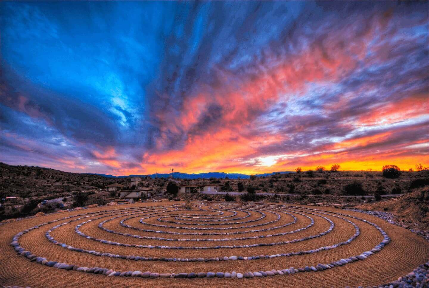 Walking labyrinth path at The Sanctuary with a beautiful sunset in the background