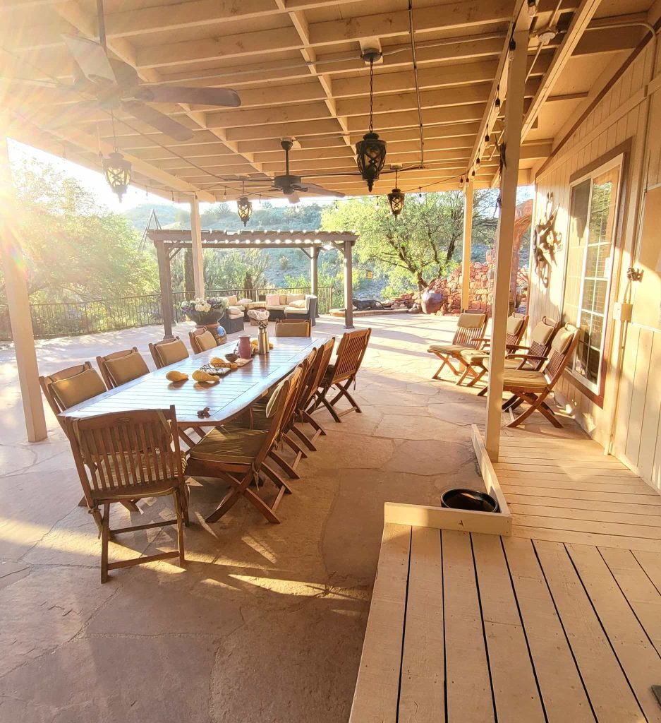 Patio gathering space with seating at The Sanctuary at Sedona surrounded by desert landscape