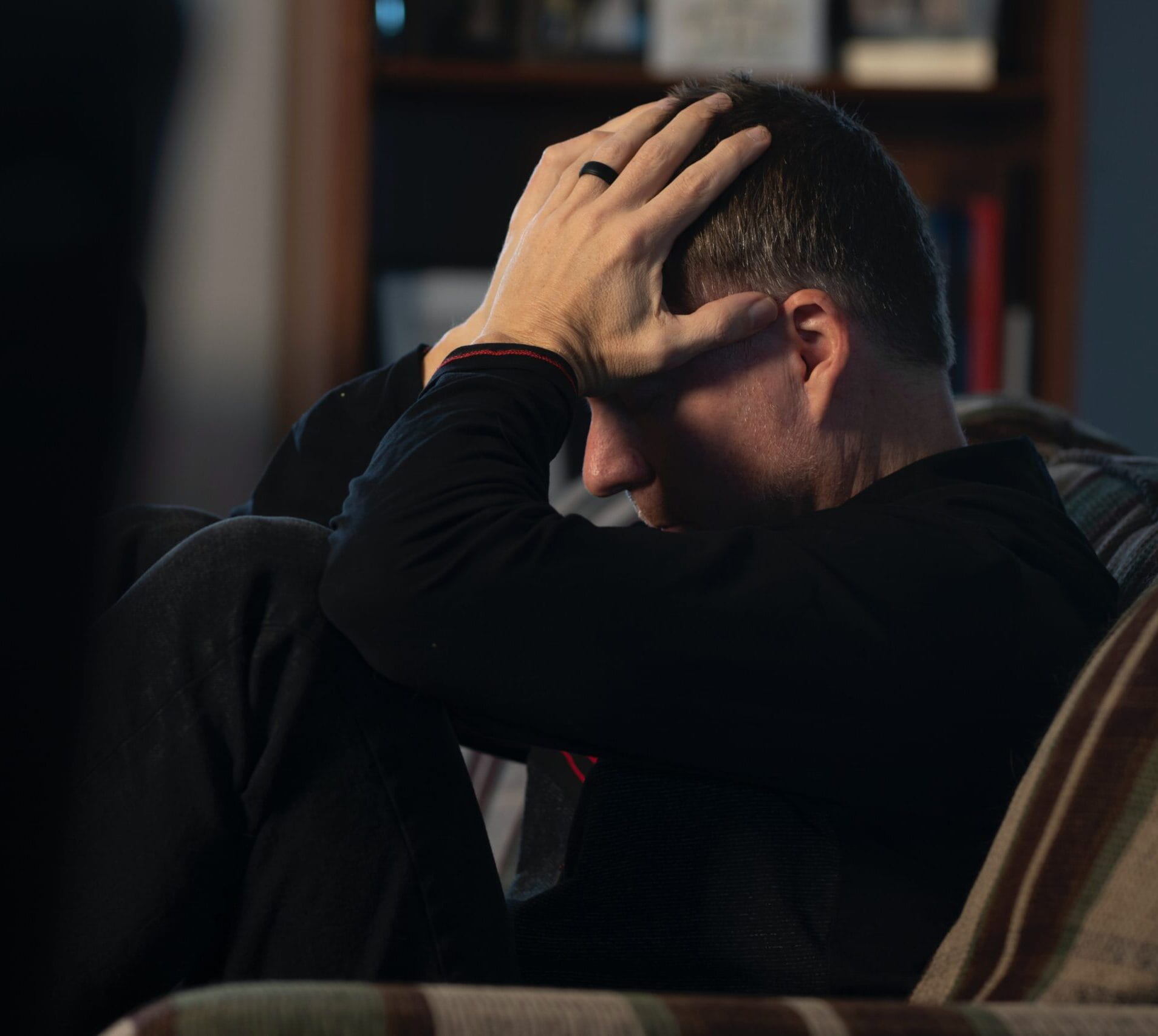 man-with-hands-covering-face-scaled-e1684938607546-1