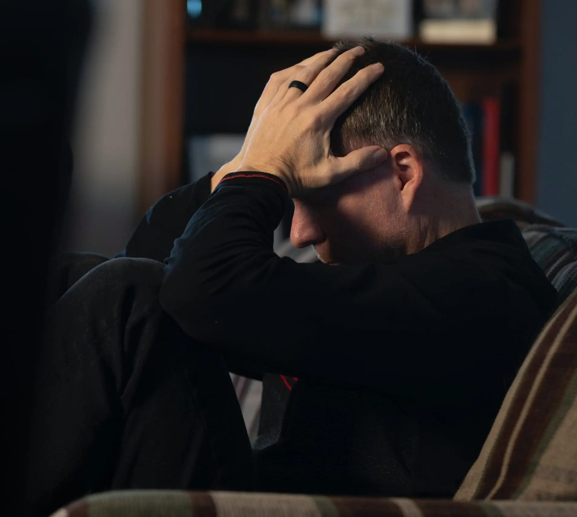 man-with-hands-covering-face-scaled-e1684938607546-1